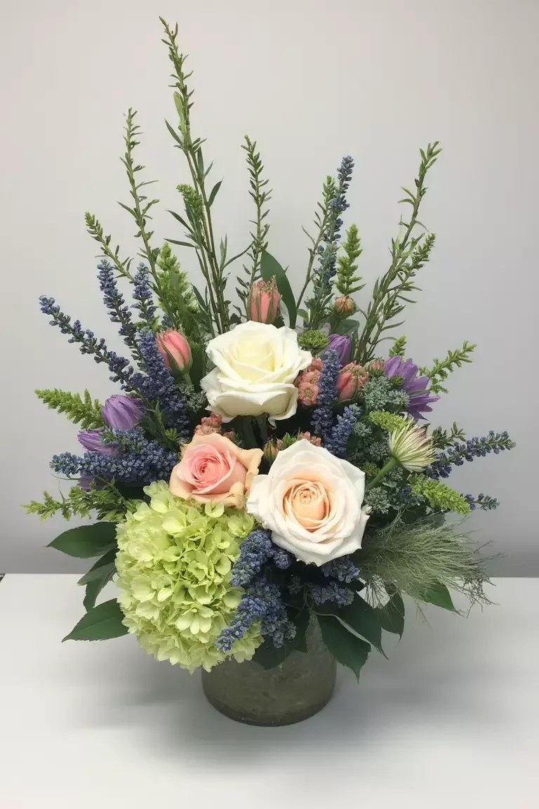 Handcrafted spring floral wreath adorning a welcoming door.
