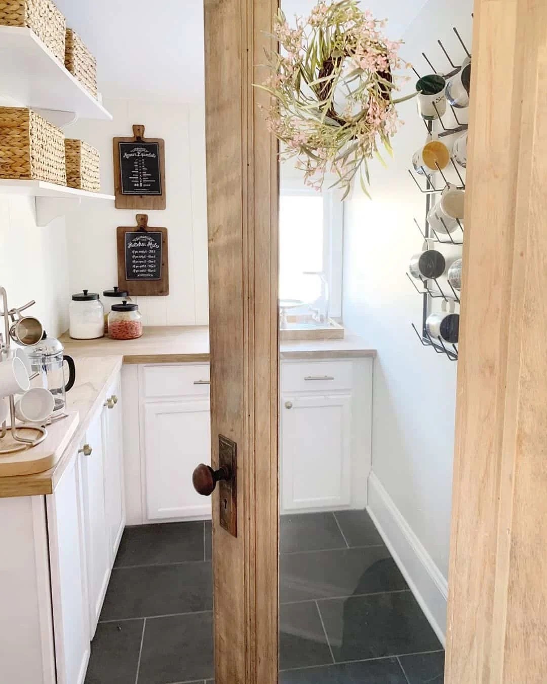Elegant navy pantry with gold accents and stylish decor.