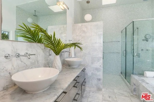 Family bathroom with colorful accents and ample storage space.