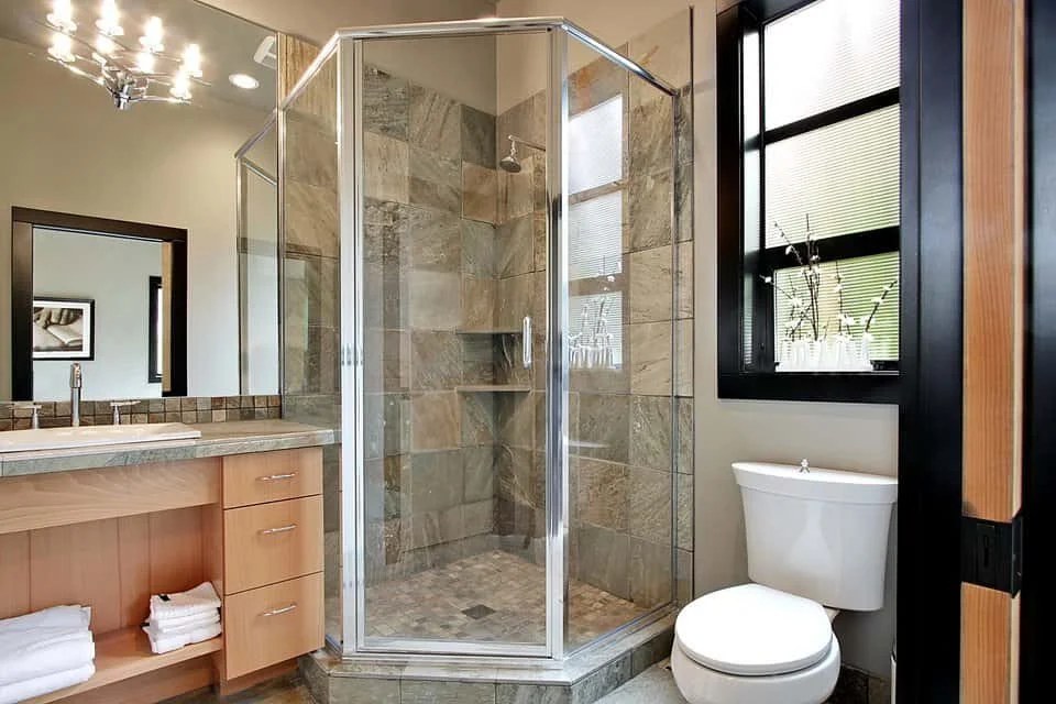 Vintage glam bathroom with ornate mirrors and golden accents.