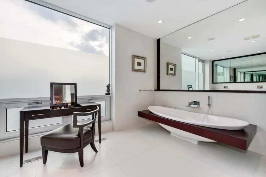 Floating bathtub provides a spa-like experience in modern bathroom.