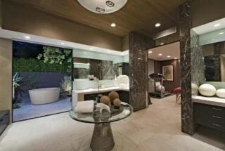Urban minimalist bathroom with industrial lighting and fixtures.