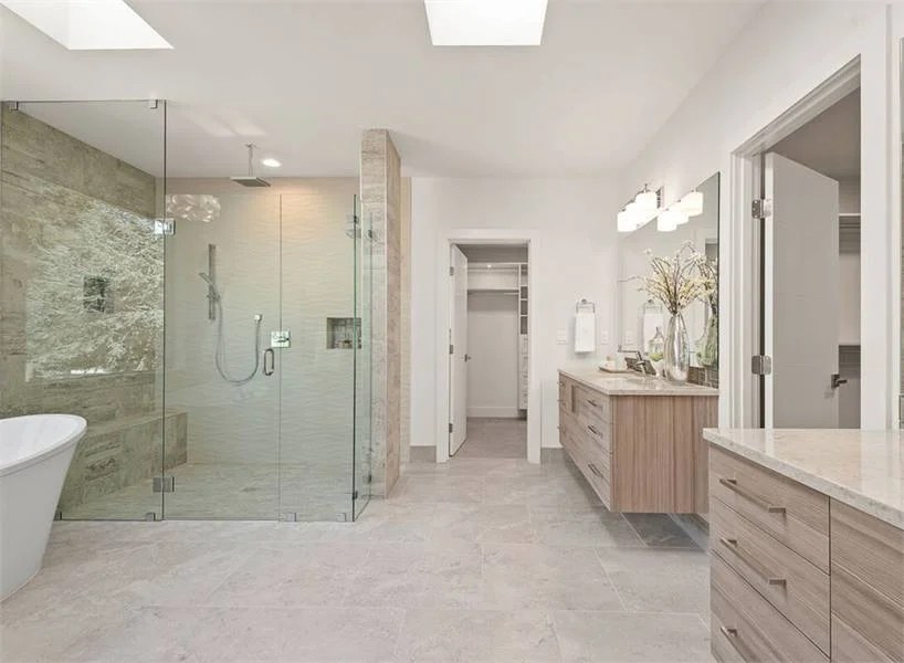 Luxury apartment bathroom with unique bathtub and chic layout.