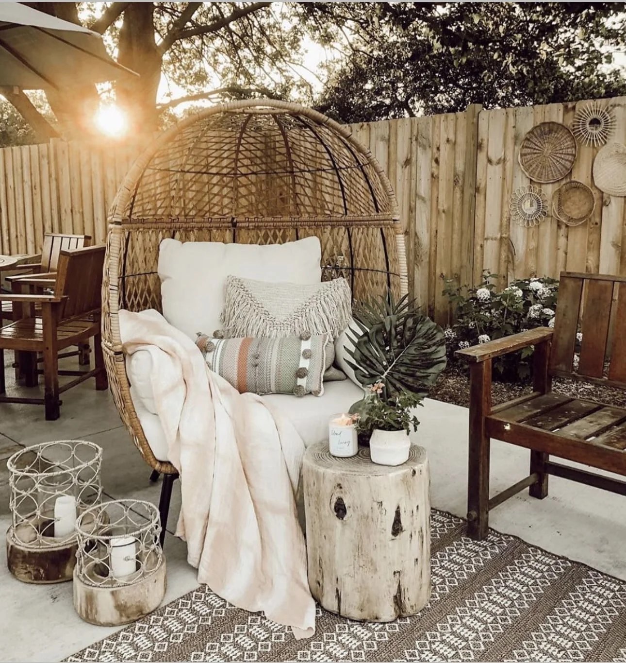Cozy rattan egg chair in a vibrant backyard setting